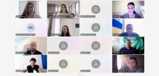 Скриншот екрана онлайн-конференції у форматі сітки, що складається з шістнадцяти вікон учасників, серед яких видно живі відеозображення десяти людей, іконки профілів та текстові підписи з їхніми іменами внизу кожного кадру